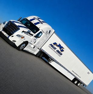 A Palos Garza tractor coupled to a 53 ft dry van trailer.