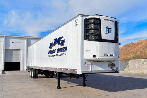 A white Palos Garza 53 ft refrigerated trailer with its nose-mounted Thermo King unit.